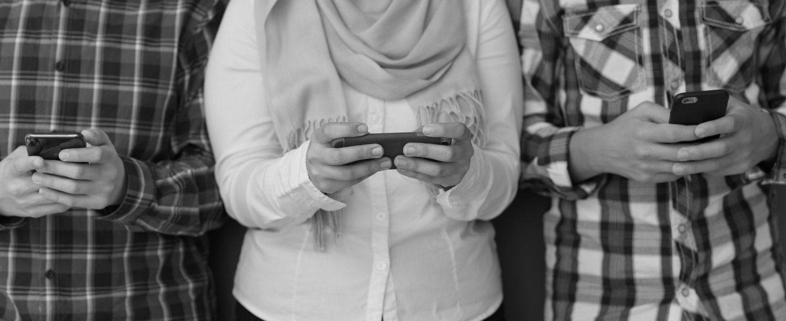 Diverse teens holding phones